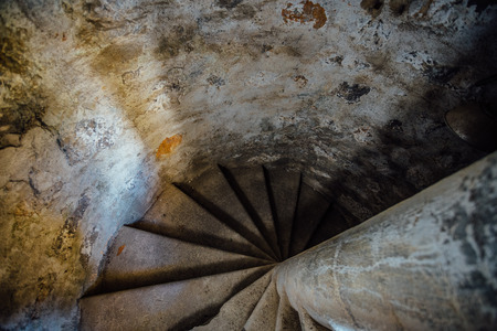 Old spiral staircase inside tower, upside viewの写真素材