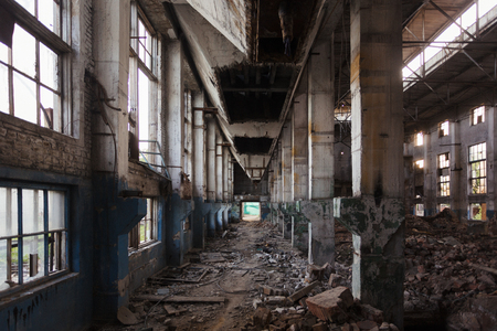 Abandoned large industrial hall with garbage. Voronezh excavator manufacturing factory.の写真素材