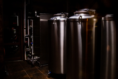 Small private brewery. Industrial stainless steel fermentation vatsの写真素材