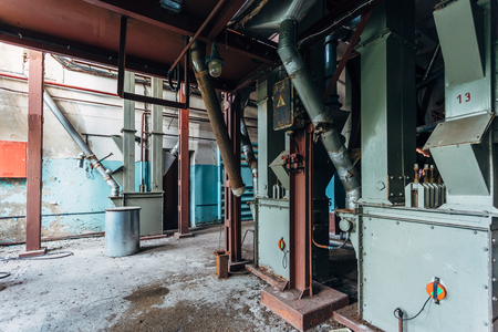 Abandoned flour milling factory. Old rusty grain cleaning air separation machine.の写真素材