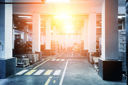 Industrial warehouse interior. Goods in carton and polyethylene packaging.