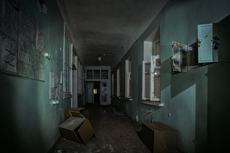 Dark creepy corridor of abandoned building.の写真素材