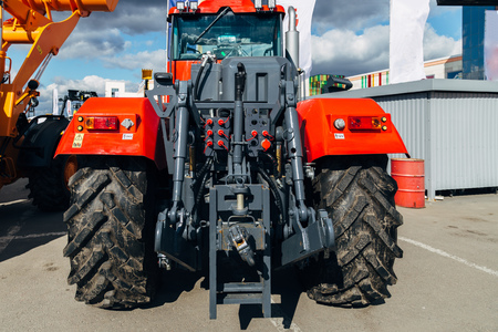 Rear view of modern agricultural tractor. Hydraulic hitch. Lifting frame. Rear mechanism for attaching trailed equipment.の写真素材