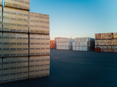 Stack of bricks packs on new construction site.の写真素材