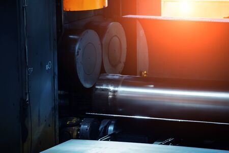 Pipe formation by using roll bending machine, close up.の写真素材