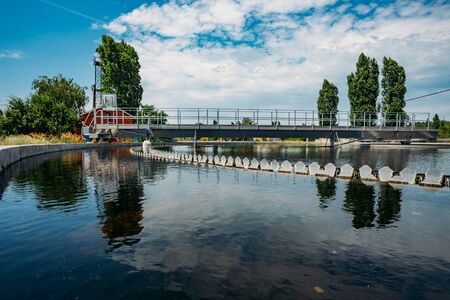Modern urban sewage treatment plant. Water flowing in sedimentation tankの写真素材