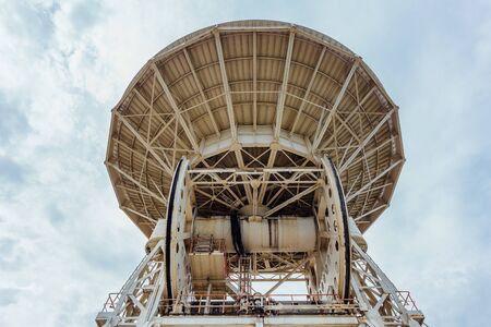 Old rusty abandoned radio telescope satellite dish.の写真素材