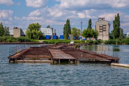 Cages for sturgeon fish farming in natural river or pond.の写真素材