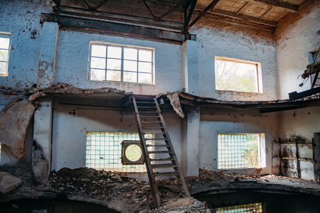 Old abandoned and ruined red brick building interior of former sugar factory in Ramon, Voronezh regionの写真素材