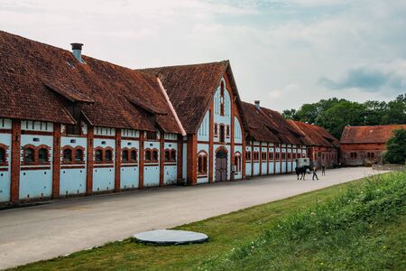 Old horse stables in courtyard of old German manor.の写真素材