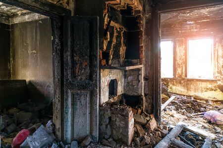 Burnt old rural house interior. Consequences of fireの写真素材