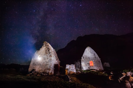 Night necropolis in Eltubu, Chegem Valley, Caucasus against starry skyの写真素材