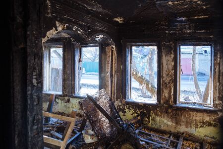 Burnt old rural house interior. Consequences of fireの写真素材