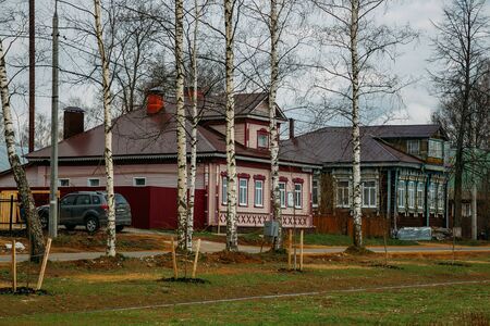 Old Russian village. Wooden houses with carved windows.の写真素材