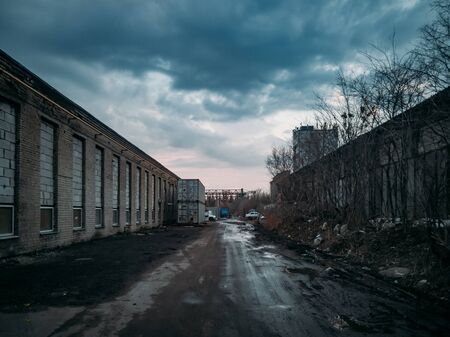 Depressive territory of abandoned industrial area, old warehouses.の写真素材