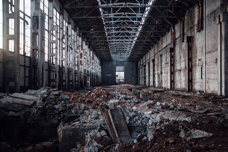 Abandoned large industrial hall with garbage waiting for demolition. Former Voronezh excavator manufacturing factoryの写真素材