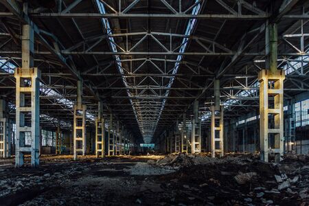 Abandoned large industrial hall with garbage waiting for demolition. Former Voronezh excavator manufacturing factory.の写真素材