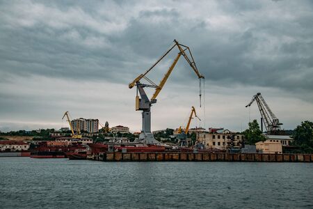 Shipyard. Sea port with cranes and dry dock for ship repair.の写真素材