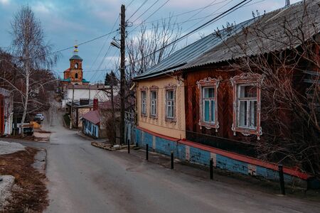 Old houses on low-rise street in old poverty part of Voronezh city in Russia.の写真素材