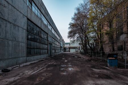 Depressive territory of abandoned industrial area, old warehouses.の写真素材