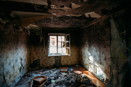 Burnt old rural house interior. Consequences of fire.の写真素材