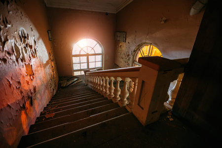 Old vintage staircase at the old abandoned building.の写真素材