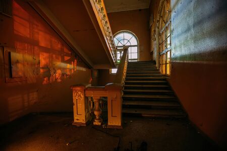 Old vintage staircase at the old abandoned building.の写真素材