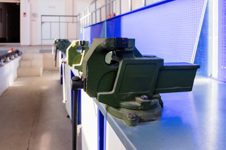 Green steel vice in the metalworking workshop.