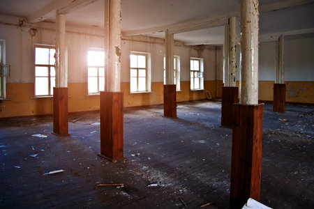 Abandoned building interior, dirty room, rotten peeled wallsの写真素材