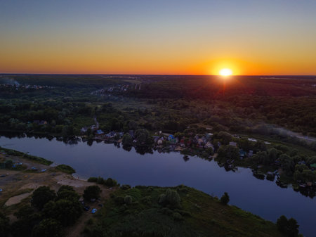 Sunset above the river in natural rural landscape.