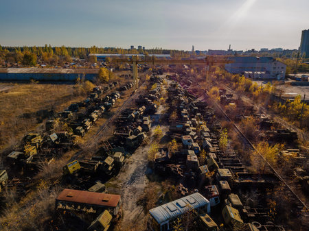 Old rusty broken Russian military cars for scrap metal in industrial area, aerial view.の写真素材