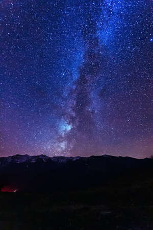 Milky Way Galaxy with stars and mountain landscape.の写真素材