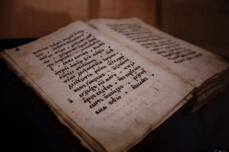 Old christian book Gospel written on Old Slavjanic (Russian Cyrillic).の写真素材