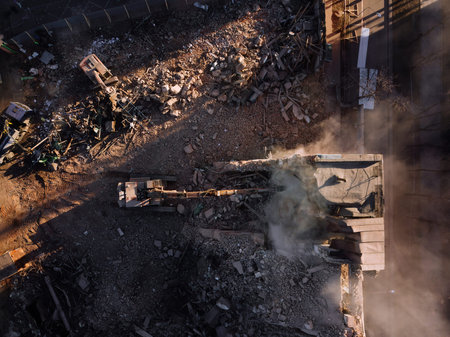 Aerial view of demolition site. Process of demolition of old industrial building.