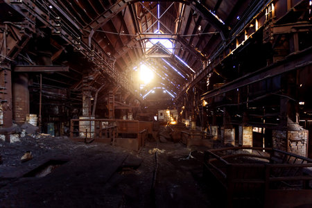 Old rusty abandoned metallurgical plant. Ruined blast furnace