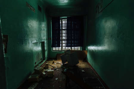 Inside old Orlovka Asylum for the insane in Voronezh Region. Dark creepy abandoned mental hospital.の写真素材
