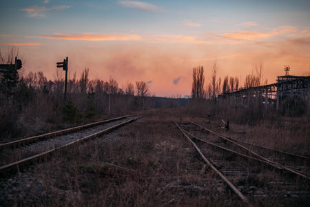Old rusty abandoned railway at the sunset.の写真素材