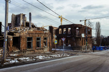 Ruined two-story brick buildings. Apocalypse, war, disaster concept.の写真素材