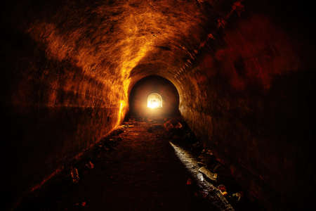 Tunnel with concrete walls in old abandoned Soviet bunker.の写真素材