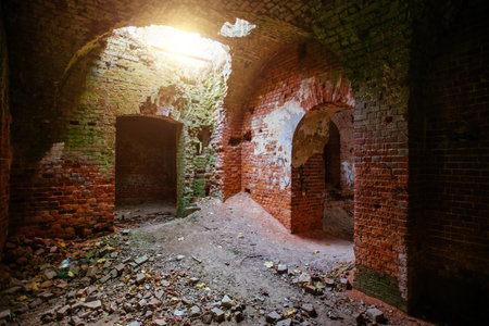 Dark old ancient abandoned red brick ruined historical building.の写真素材