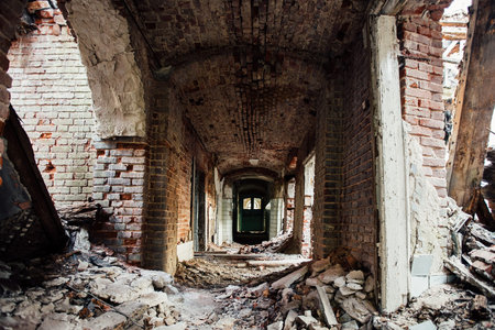 Dark dirty corridor of old abandoned building.
