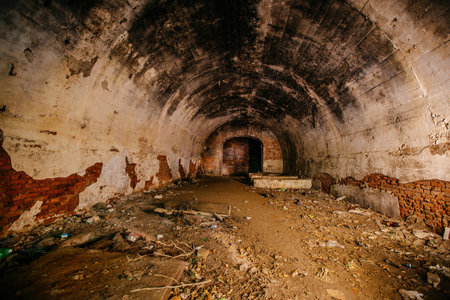 Large old historical underground red brick tunnel.の写真素材