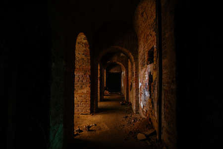 Vaulted red brick dungeon under old castle.の写真素材