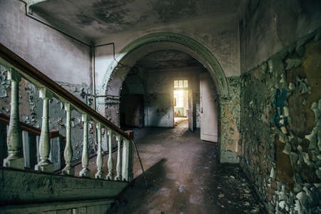 Dark and creepy corridor of old abandoned mental hospital.の写真素材