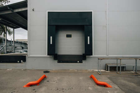 Closed door of transport terminal for truck deliveries and loading.の写真素材