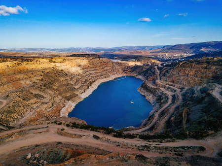 Abandoned limestone quarry with heart shaped lake at the bottom.の写真素材