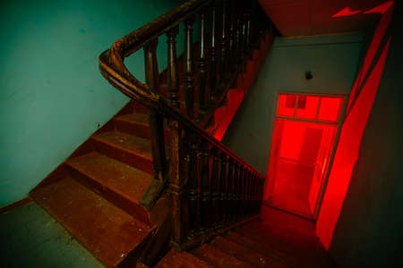 Dark and creepy corridor of old abandoned mental hospital at night.の写真素材