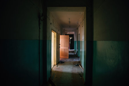 Dark dirty corridor of old abandoned building.