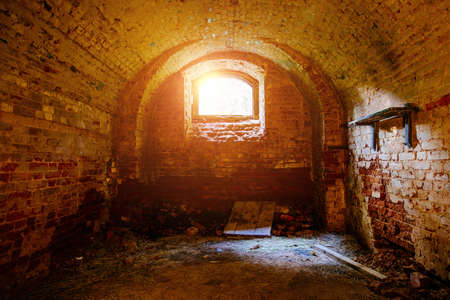 Vaulted red brick dungeon under old mansion.の写真素材