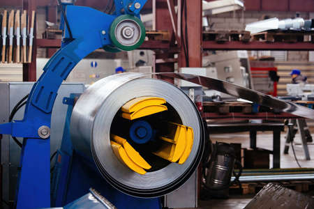 Roll of galvanized steel sheet at metalworking factory.の写真素材